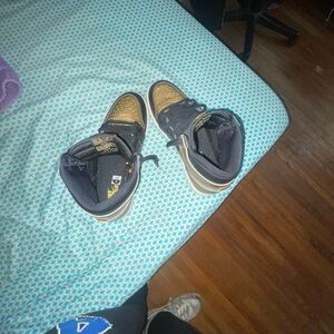 Jordan Black and Gold Sneakers